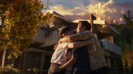 Man-soo is seen hugging his family in front of a house. (Image via CJ Entertainment)